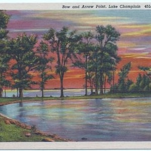 May include: A postcard depicting a sunset over a lake with a small island in the foreground. The sky is a vibrant mix of pink, orange, and purple, with fluffy white clouds. The island is covered in green trees, and the lake is a calm blue.