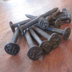 Assemblage of 12 Railroad Nails Railroadiana 1910s to 1960s Spikes Hooks
