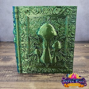May include: A green, embossed book cover with a decorative design featuring three mushrooms. The mushrooms are a light green color and have a textured surface.
