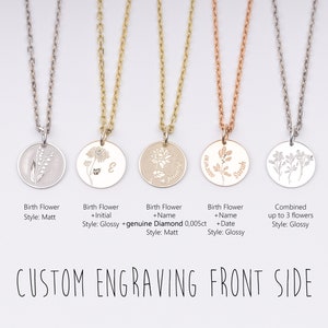 May include: Five silver necklaces with different charms. The charms are round and feature engraved birth flowers, initials, names, and dates. The necklaces are available in different styles, including matt and glossy finishes.  The text "CUSTOM ENGRAVING FRONT SIDE" is displayed below the necklaces.