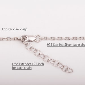 May include: A silver cable chain necklace with a lobster claw clasp and a 1.25 inch extender. The chain is made of 925 sterling silver.