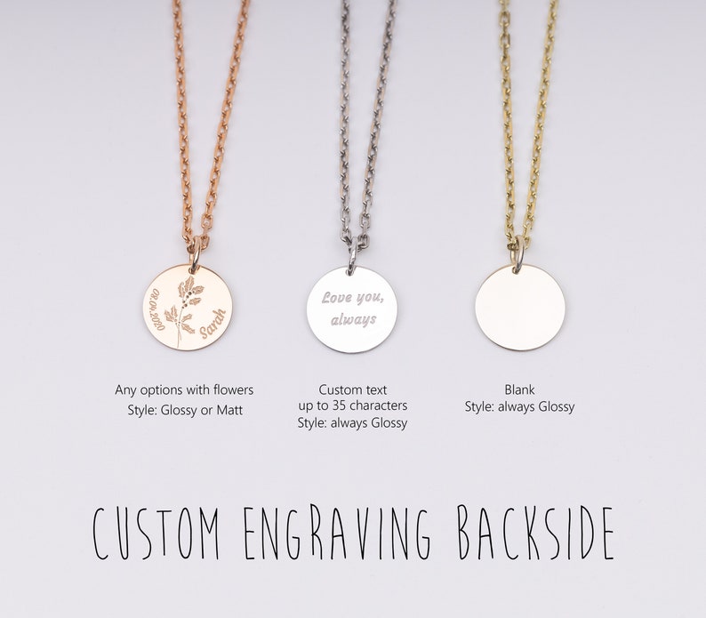 May include: Three silver necklaces with round pendants. The pendant on the left has a floral design and the text "Sarah" engraved on it. The middle pendant has the text "Love you, always" engraved on it. The pendant on the right is blank.