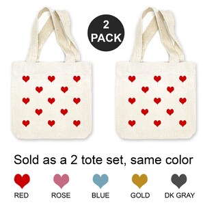 These mini heart tote bags are available in 5 colors and sold as a 2 piece set of the same color heart.