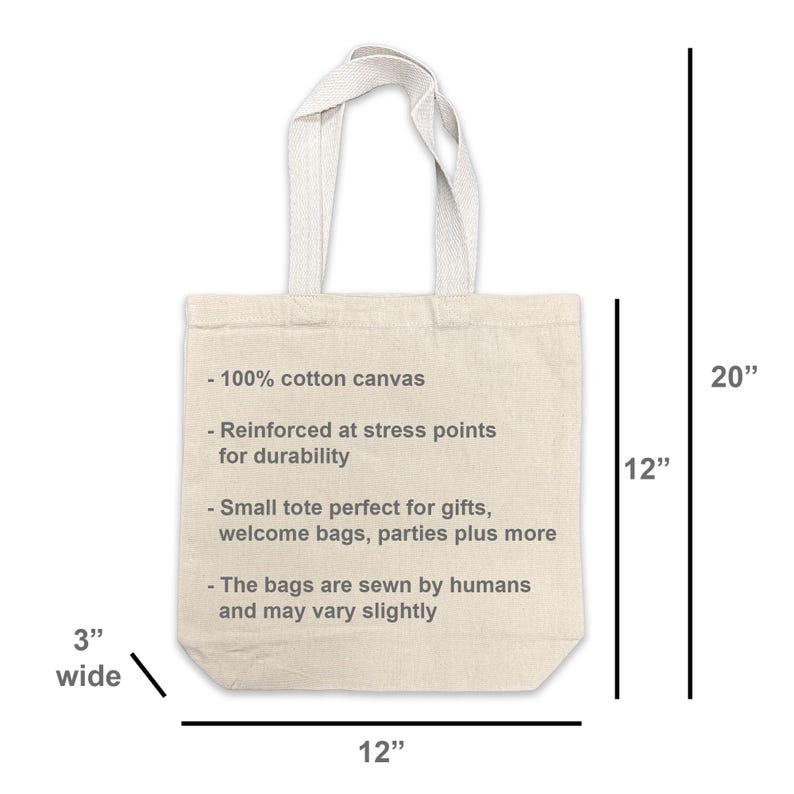 May include: A natural canvas tote bag with a 12-inch width, 20-inch height, and 3-inch depth. The bag features a reinforced design and includes text indicating it's made of 100% cotton canvas.