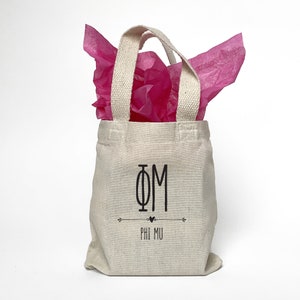 Boho theme Phi Mu sorority tote bag is perfect for gift giving as a reusable gift bag. Made of cotton canvas it is durable too.