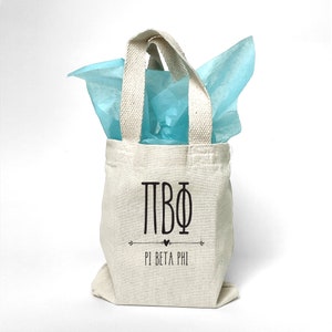 Boho theme Pi Beta Phi sorority tote bag is perfect for gift giving as a reusable gift bag. Made of cotton canvas it is durable too.