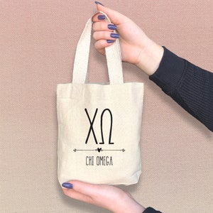 Boho them Chi Omega sorority tote bag is perfect for gift giving as a reusable gift bag. Made of cotton canvas it is durable too.