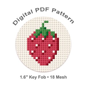 May include: A digital PDF pattern for a key fob with a pixelated strawberry design. The strawberry is red with white highlights and a green stem, on a cream background. Text reads "Digital PDF Pattern" and "1.6" Key Fob • 18 Mesh."