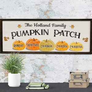 May include: A rustic wooden sign with the text "The Holland Family Pumpkin Patch" and five pumpkins with names on them: Robert, Whitney, Cambria, Camdyn, and Camryn.
