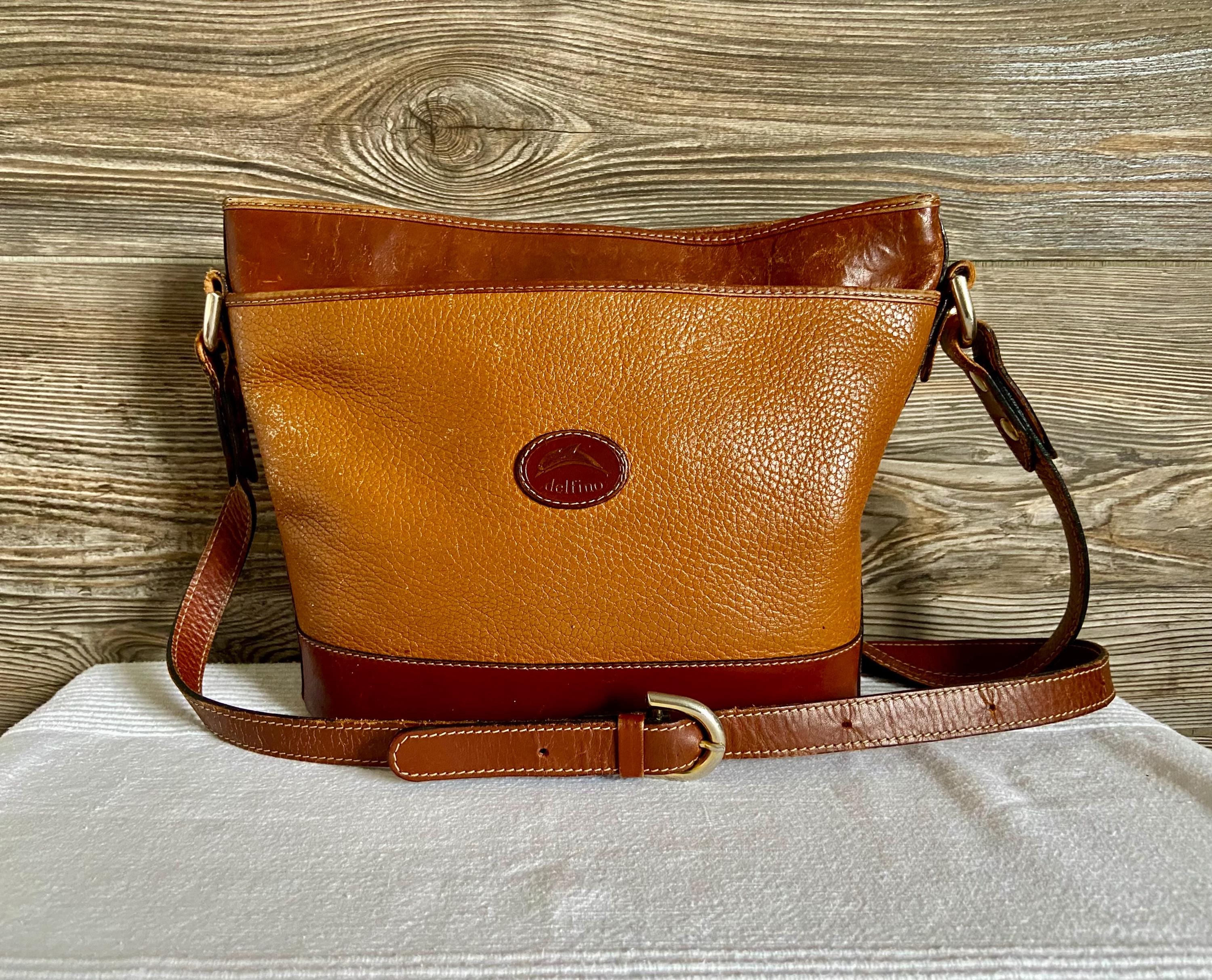 delfino leather backpack Dooney & Bourke Women's Florentine Zip Pod in Salmon Pack all you need for everyday commutes or sudden voyages in our Dolphin Studded Backpack TSD Brand Dolphin Backpack Brown