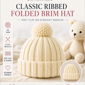 May include: A cream-coloured ribbed knit hat with a folded brim and a matching pom-pom on top. The text on the image includes MK CRAFTS UK, CLASSIC RIBBED FOLDED BRIM HAT, KNIT FLAT ON STRAIGHT NEEDLES, DK YARN, 4 mm NEEDLES, and 5 SIZES.