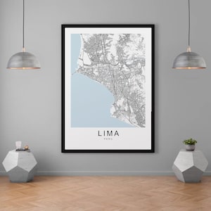 May include: A black and white map print of Lima, Peru, in a black frame. The map shows the city's streets and coastline. The words "Lima" and "Peru" are printed below the map.