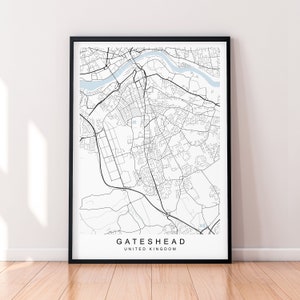 May include: A black and white map print of Gateshead, United Kingdom. The map shows the city's streets and waterways.