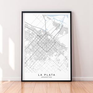 May include: A black and white line art map of La Plata, Argentina. The map shows the city's street grid and surrounding areas.