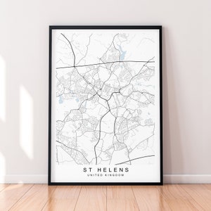 May include: A black and white map print of St Helens, United Kingdom, in a black frame.