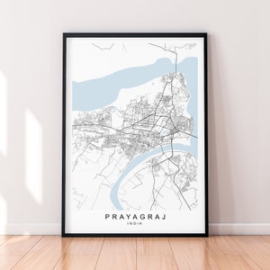 May include: A black and white map print of Prayagraj, India, with a light blue river and surrounding area. The city name and country are printed at the bottom of the map.