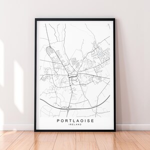 May include: A black and white map print of Portlaoise, Ireland. The map shows the city's streets and roads.