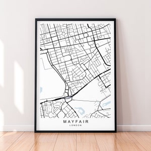May include: Black and white map print of Mayfair, London, in a black frame. The map shows the streets and landmarks of the neighborhood.