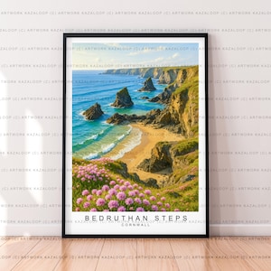 May include: Framed print of Bedruthan Steps in Cornwall, featuring a coastal landscape with turquoise water, sandy beach, and rugged cliffs. Pink flowers bloom in the foreground. The artwork is in a black frame.