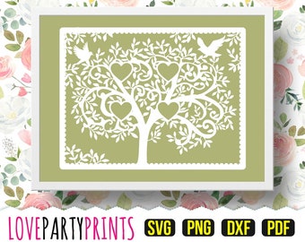 May include: A white silhouette of a tree with hearts and birds on a green background. The tree is surrounded by a decorative border. The image is in a white frame.
