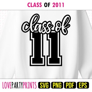 May include: White sweatshirt with the text "Class of 2011" in black script and block lettering. The number "11" is prominently displayed. The top of the image has the text "CLASS OF 2011" in pink.