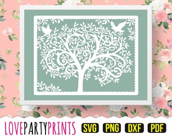 May include: A white silhouette of a tree with intricate branches and leaves, with two birds flying above. The tree is set against a light green background and framed in a white border.