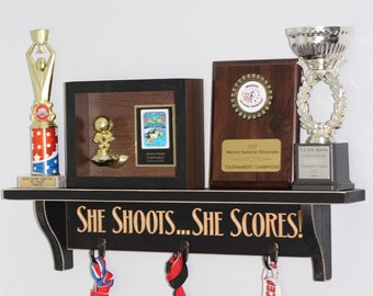 She shoots... She scores!  - Trophy Shelf
