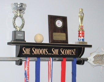 She shoots... She scores!  - Trophy Shelf