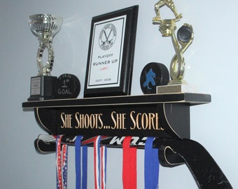 She shoots... She scores!  - Trophy Shelf