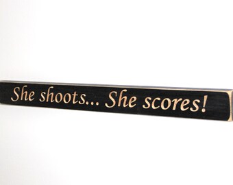 She shoots... She Scores!  -  Sign