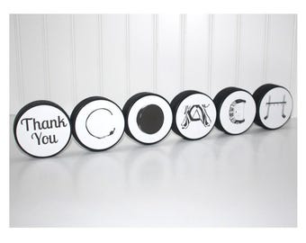 "COACH" Pucks Sign