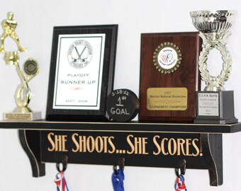 She shoots... She scores!  - Trophy Shelf