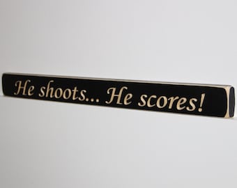 He shoots... He scores! - Sign