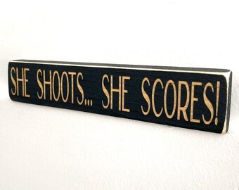 She shoots... She Scores!  -  Sign