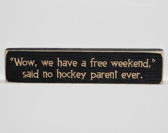 "Wow, we have a free weekend," said no hockey parent ever.  -  Sign