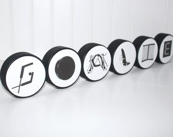 "GOALIE" Pucks Sign