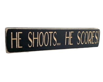 He shoots... He scores!  -  Photo Sign