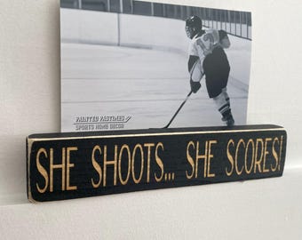 She shoots... She scores!  -  Photo Sign