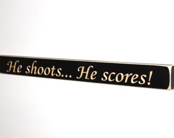 He shoots... He scores! - Sign