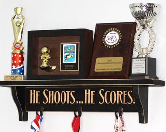 He shoots... He scores!  - Trophy Shelf