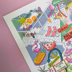 May include: A colorful illustration of a motel in Palm Springs, California. The illustration features a pool with a unicorn float, a pineapple float, and a slice of pizza. There are palm trees, lounge chairs, and a welcome sign that says "Welcome to Palm Springs".