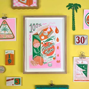 May include: A pink and green illustration of a juice carton with the text "100% Freshly Squeezed Creative Juice 1 of your 5 a day".