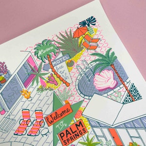 May include: A colorful illustration of a Palm Springs motel scene with a pool, palm trees, and a sign that says "Welcome to Palm Springs".
