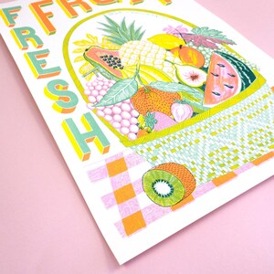 May include: A colorful illustration of a basket overflowing with fresh fruit, including watermelon, pineapple, papaya, grapes, kiwi, and strawberries. The word "FRESH" is written in large, stylized letters in the upper left corner of the image.