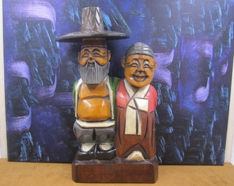 Carlos and Juan the happy  pioneer men wood figurine