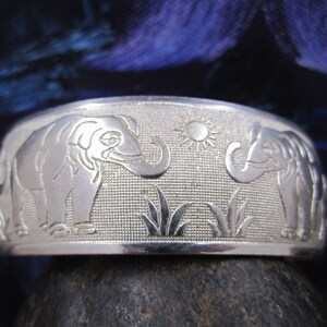 Stunning elephant herd silver crafted cuff