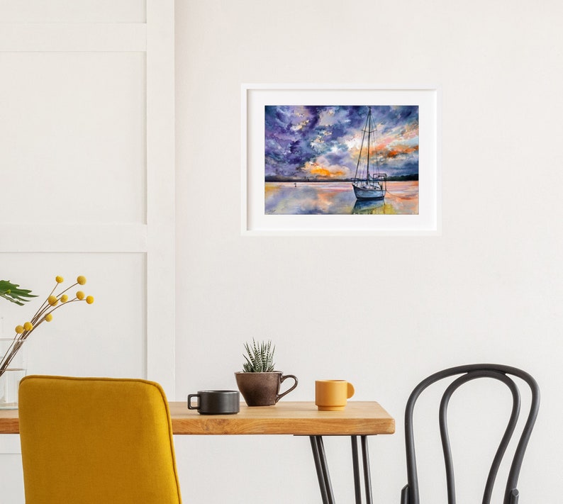 May include: A watercolor painting of a sailboat anchored in a calm body of water. The sky is a mix of purple, blue, and orange hues, creating a dramatic sunset effect.