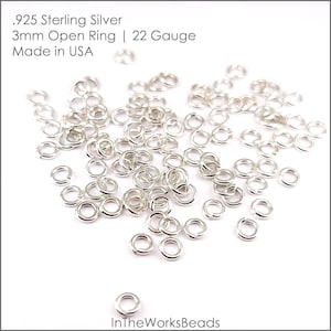 May include: A pile of 3mm sterling silver open jump rings, 22 gauge, made in the USA.  .925 Sterling Silver 3mm Open Ring | 22 Gauge Made in USA InTheWorksBeads