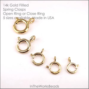 May include: Five gold-filled spring clasps in different sizes. The clasps are open ring or close ring style. 14k Gold Filled Spring Clasps Open Ring or Close Ring 5 sizes available Made in USA InTheWorksBeads