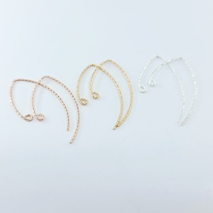 May include: Three pairs of twisted wire earring hooks in gold, rose gold, and silver.